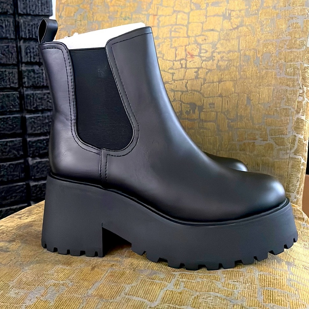 Size 10 Black Platformed boots. New in box.